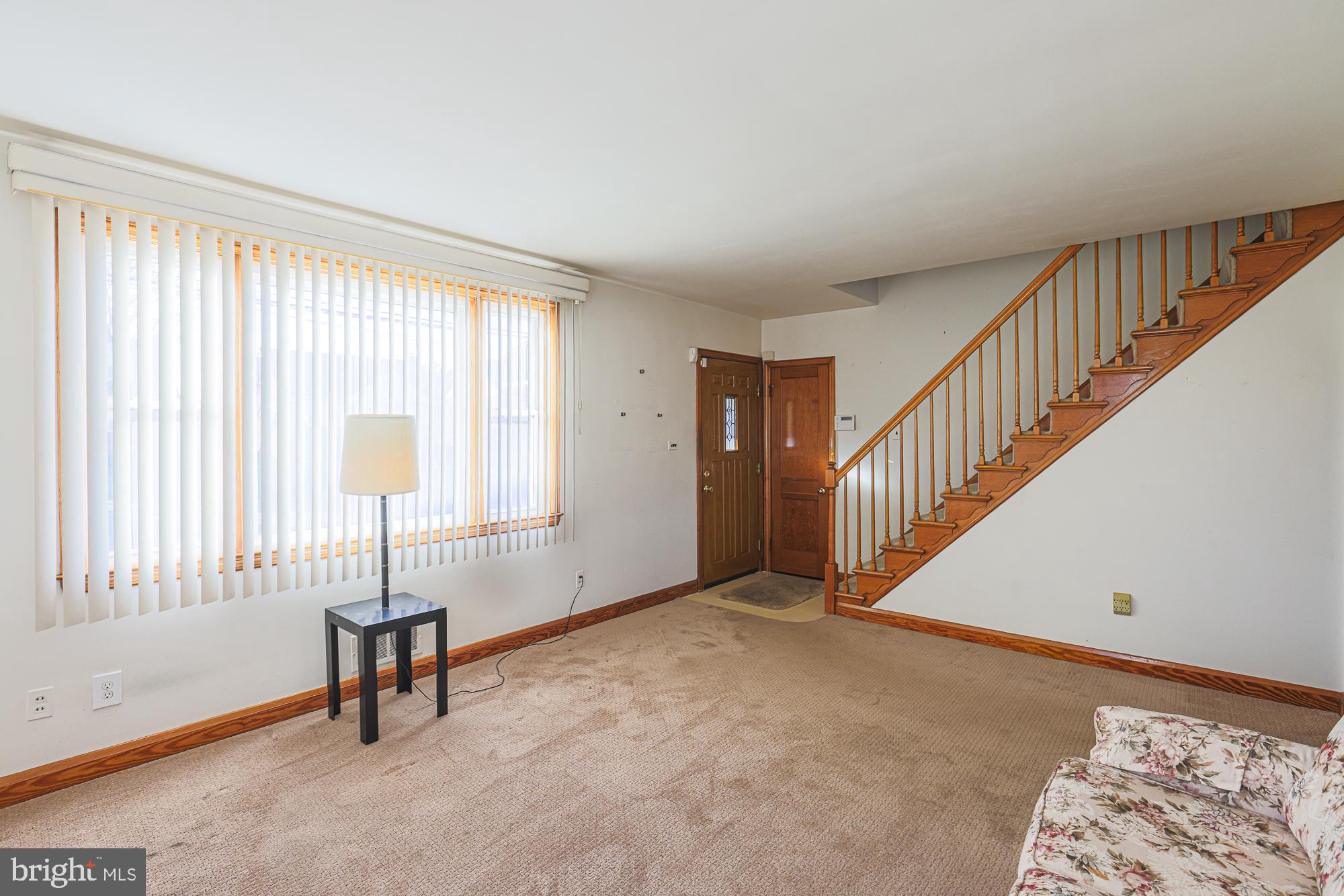 8506 Coco Road Baltimore, MD 21237 - Photo 5 of 39 a view of an empty room with a window