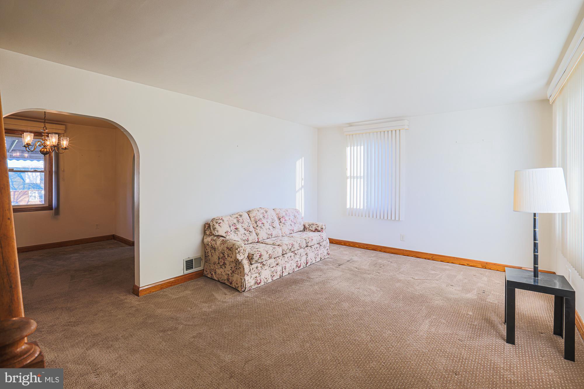 8506 Coco Road Baltimore, MD 21237 - Photo 6 of 39 a room with a bed and a table