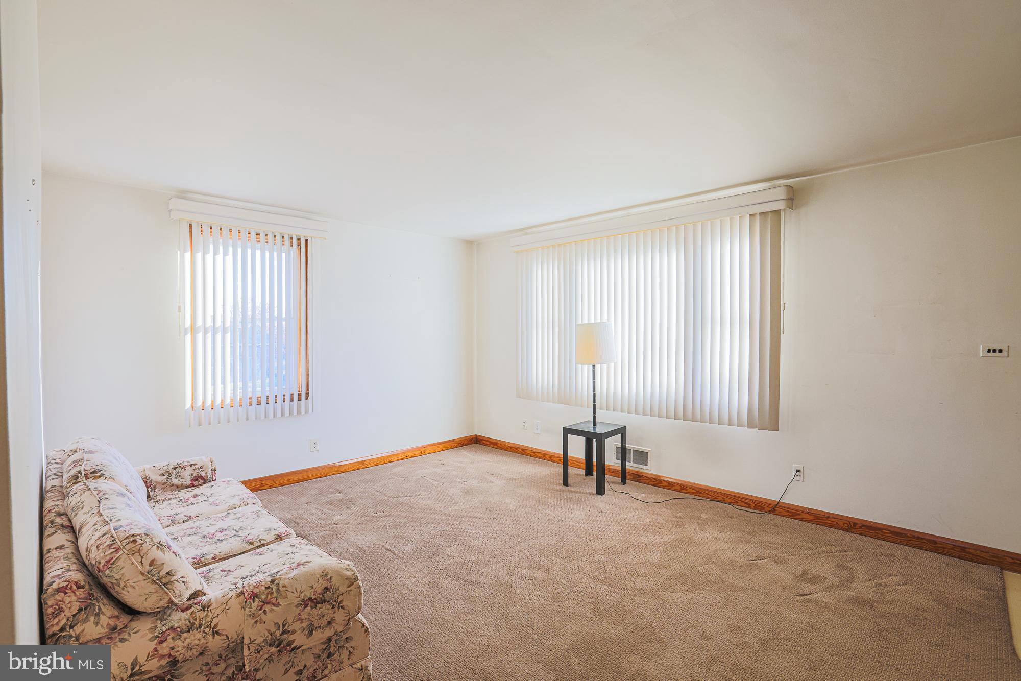 8506 Coco Road Baltimore, MD 21237 - Photo 7 of 39 a bedroom with a bed and a window