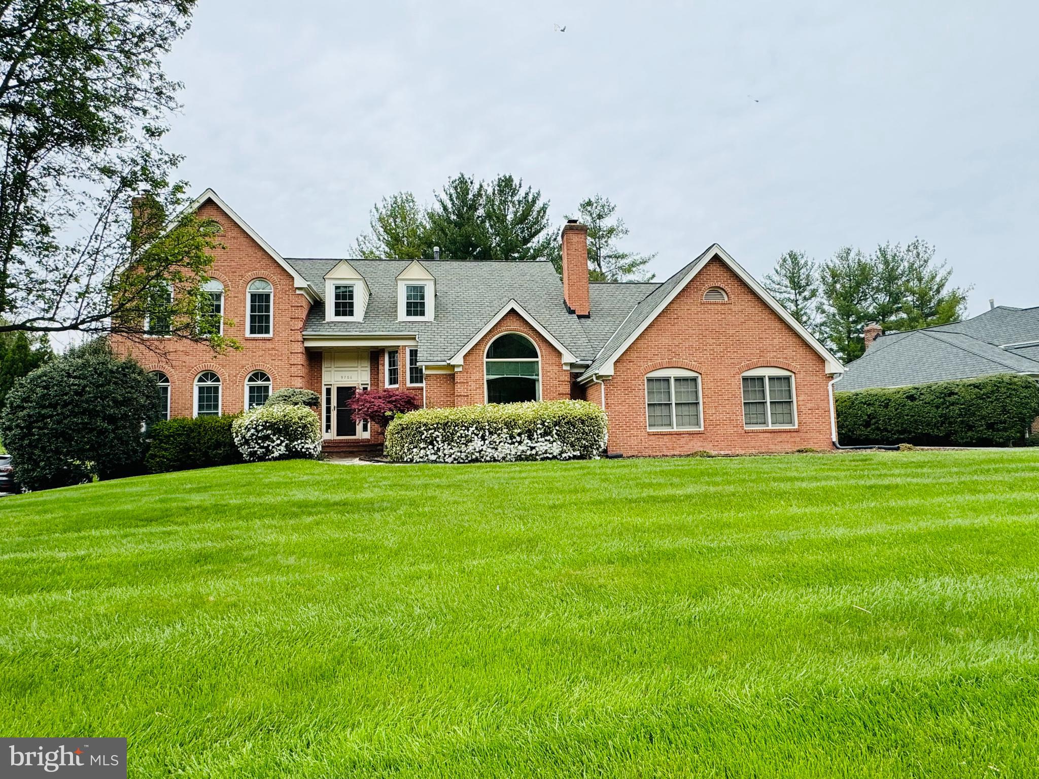 9706 Middleton Ridge Road Vienna, VA 22182 - Photo 1 of 17 a front view of a house with a yard