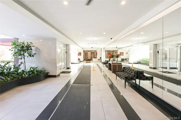 a view of a lobby with black carpet