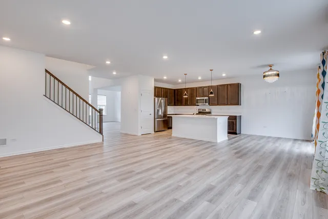 a view of kitchen with cabinets and wooden floor
