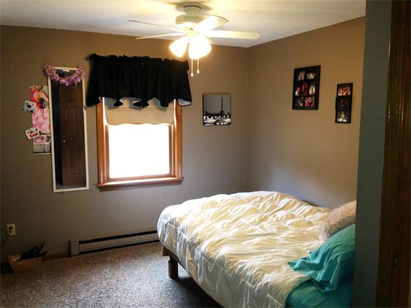 222 Hunt Road Oakham, MA 01068 - Photo 19 of 30 a bedroom with a bed and a mirror