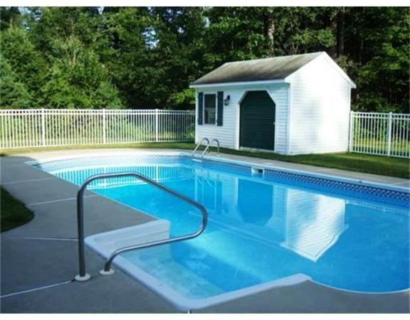 222 Hunt Road Oakham, MA 01068 - Photo 2 of 30 a view of a swimming pool with a yard