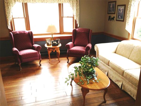 222 Hunt Road Oakham, MA 01068 - Photo 7 of 30 a living room with furniture and a large window