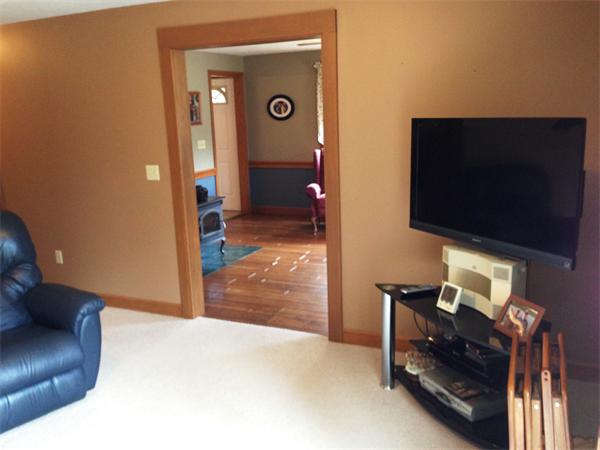 222 Hunt Road Oakham, MA 01068 - Photo 10 of 30 a living room with furniture and a flat screen tv