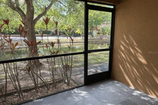 a view of a porch with a trees in the background