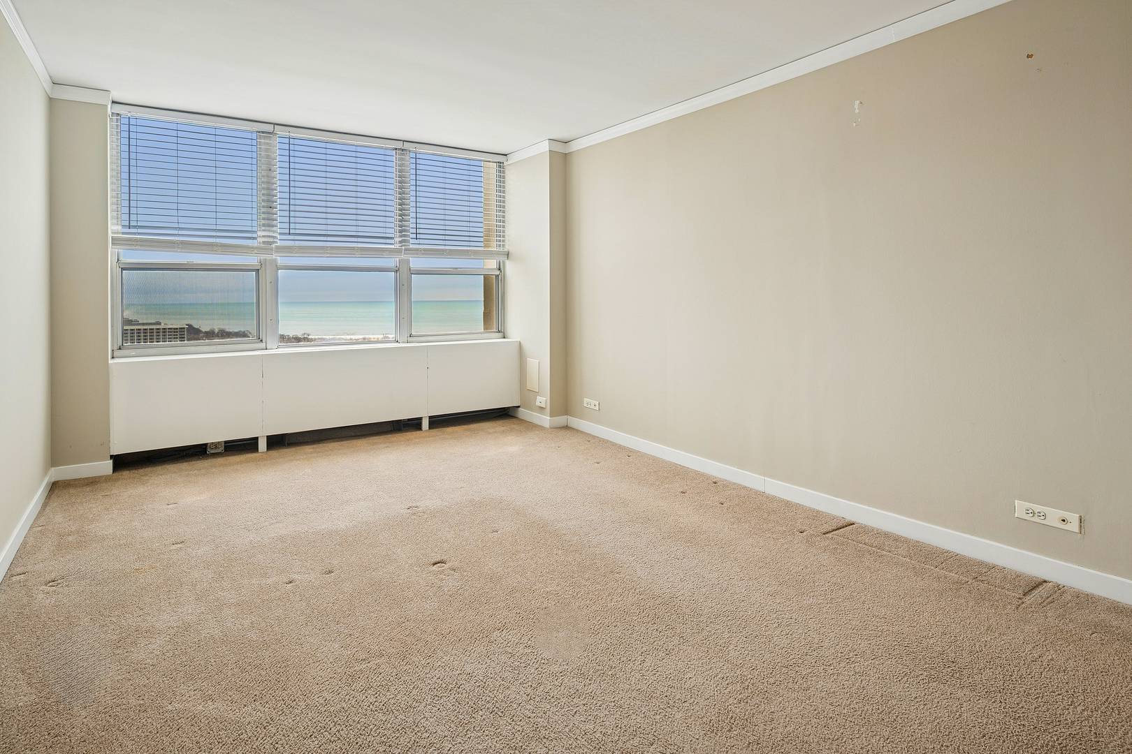 655 West Irving Park Road, Unit 3706 Chicago, IL 60613 - Photo 11 of 16 an empty room with wooden floor and window