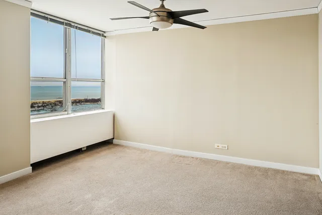 a view of an empty room and bathroom