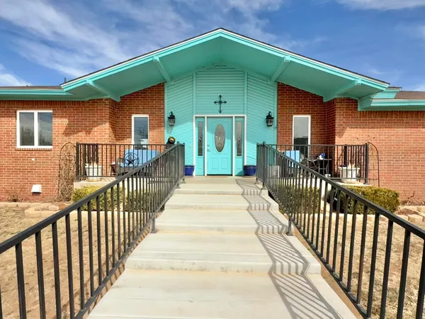 a view of a house with wooden deck