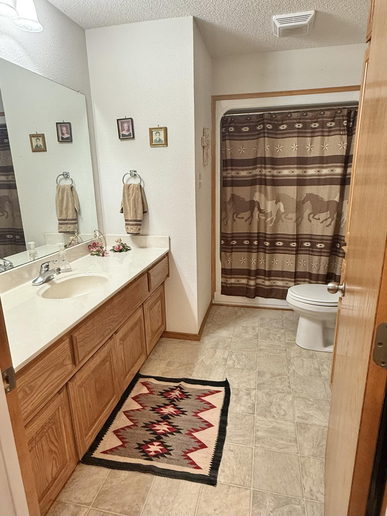 19 Ridgeview Farwell, TX 79325 - Photo 23 of 40 a bathroom with a sink and a mirror