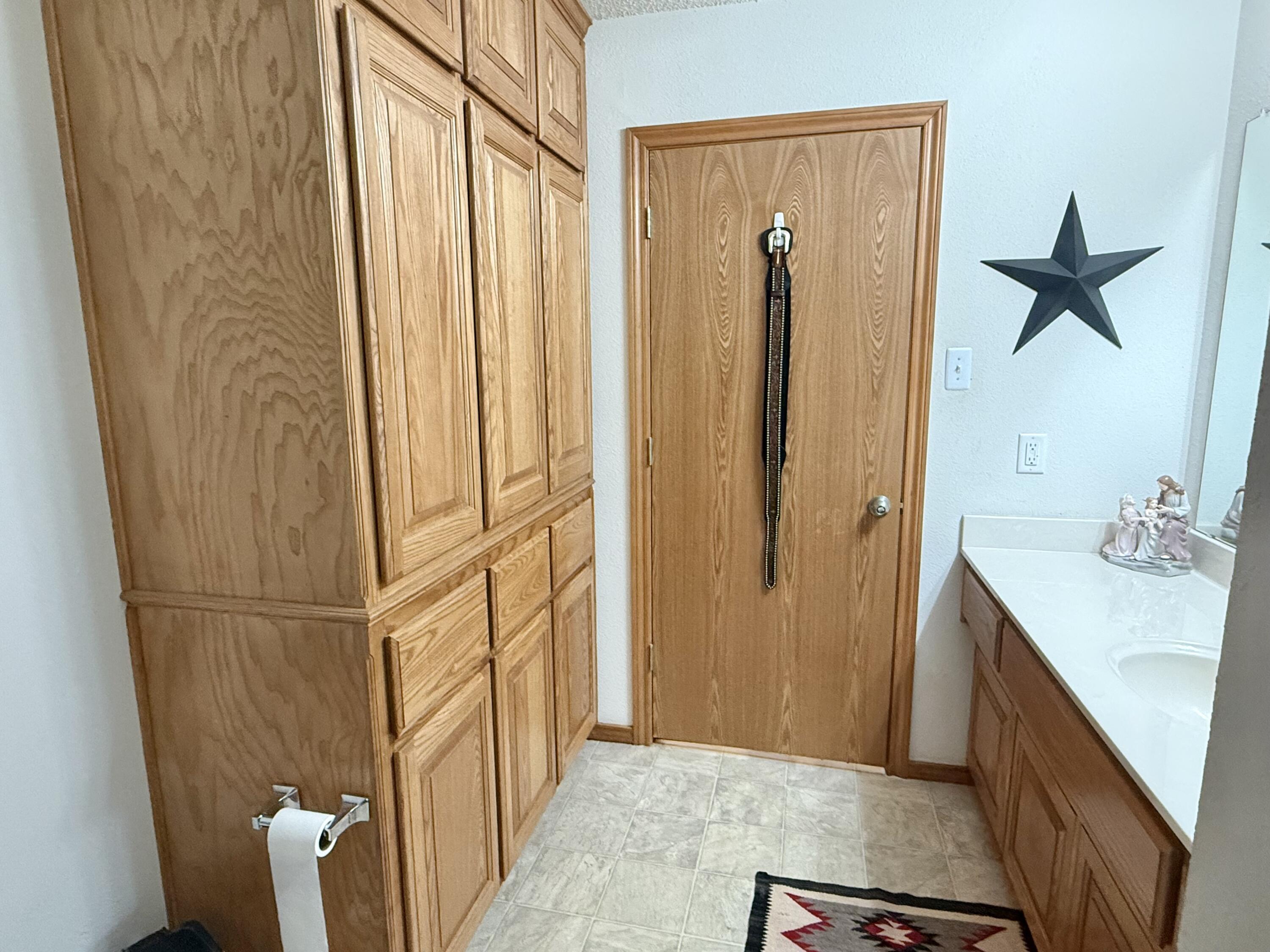 19 Ridgeview Farwell, TX 79325 - Photo 24 of 40 a bathroom with a shower and a sink