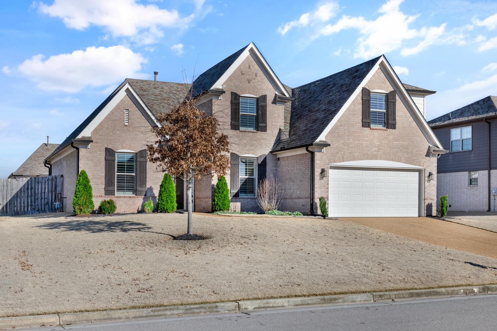 235 Misty Fields Road Oakland, TN 38060 - Photo 2 of 40 View of front of property with brick siding, concrete driveway, and a garage