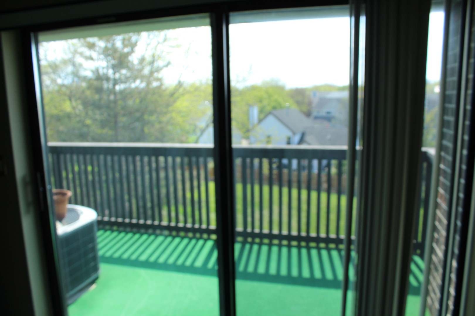 920 Vose Drive, Unit 402 Gurnee, IL 60031 - Photo 23 of 42 a view of a balcony with a floor to ceiling window