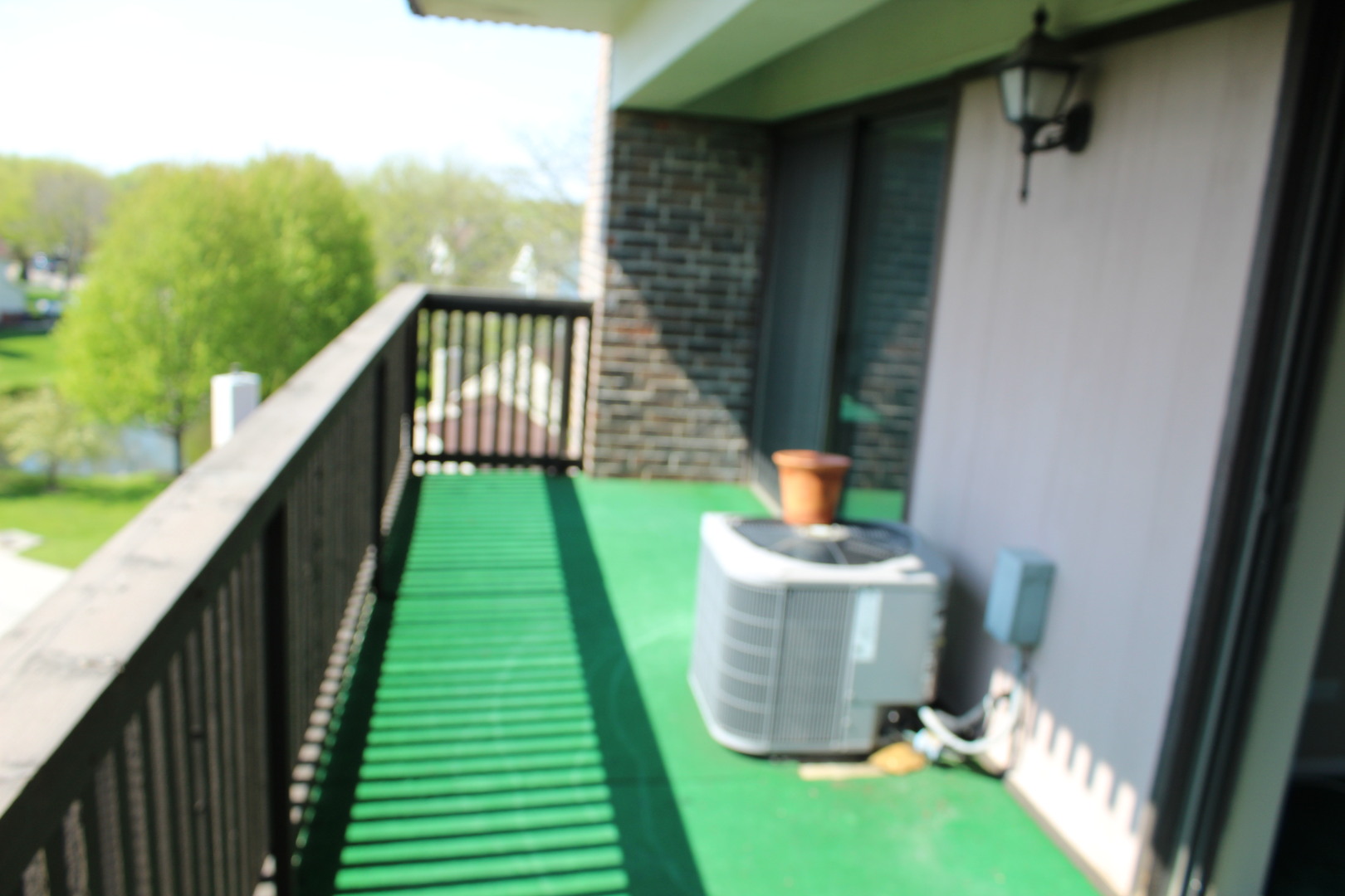 920 Vose Drive, Unit 402 Gurnee, IL 60031 - Photo 35 of 42 a balcony with sitting area