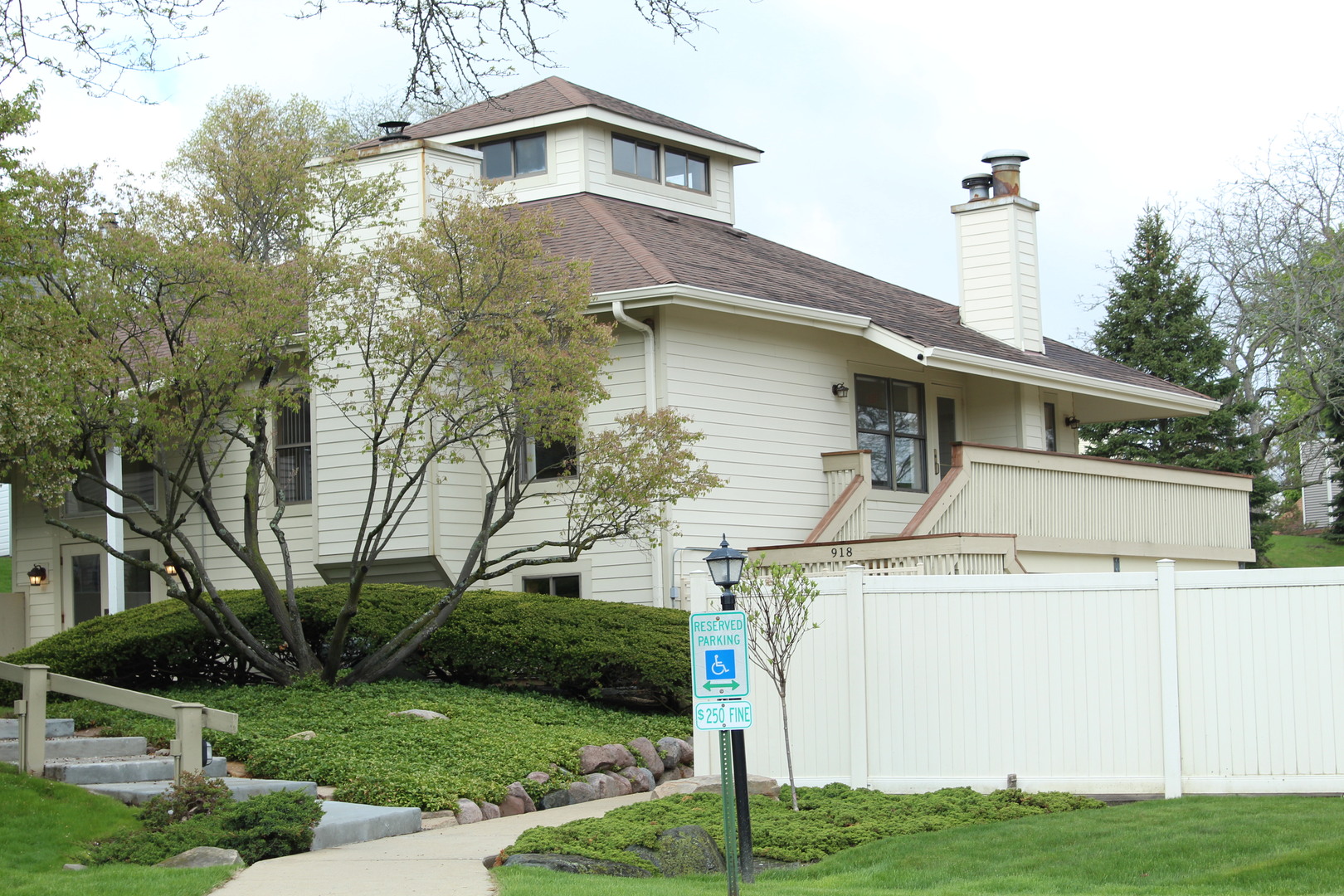 920 Vose Drive, Unit 402 Gurnee, IL 60031 - Photo 10 of 42 a front view of a house with a yard