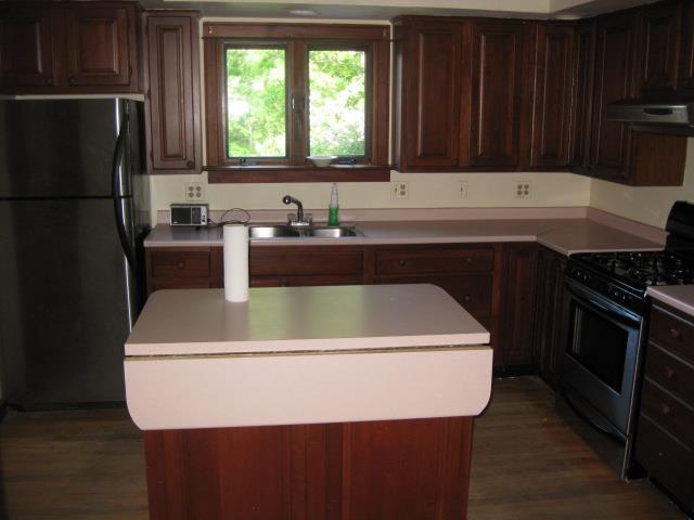194 Weeks Mills Road South China, ME 04358 - Photo 11 of 27 Kitchen with island and wood floor