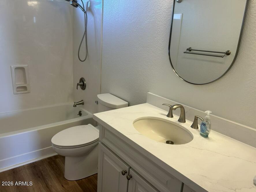 425 West Rio Salado Parkway, Unit 112 Tempe, AZ 85281 - Photo 12 of 17 a bathroom with a sink a toilet and a mirror