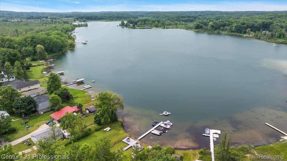 9867 Rainbow Ridge Drive Schoolcraft, MI 49087 - Photo 72 of 82 Expansive waterfront property featuring a large lake, surrounding wooded areas, and multiple private docks