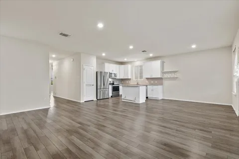 a view of kitchen with wooden floor