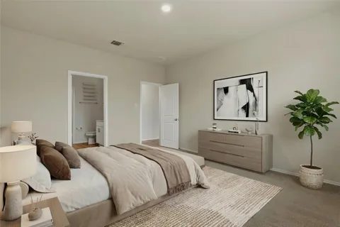 a bedroom with a bed and a painting on the wall