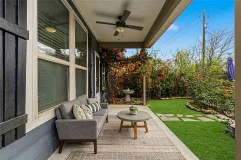 a backyard of a house with table and chairs