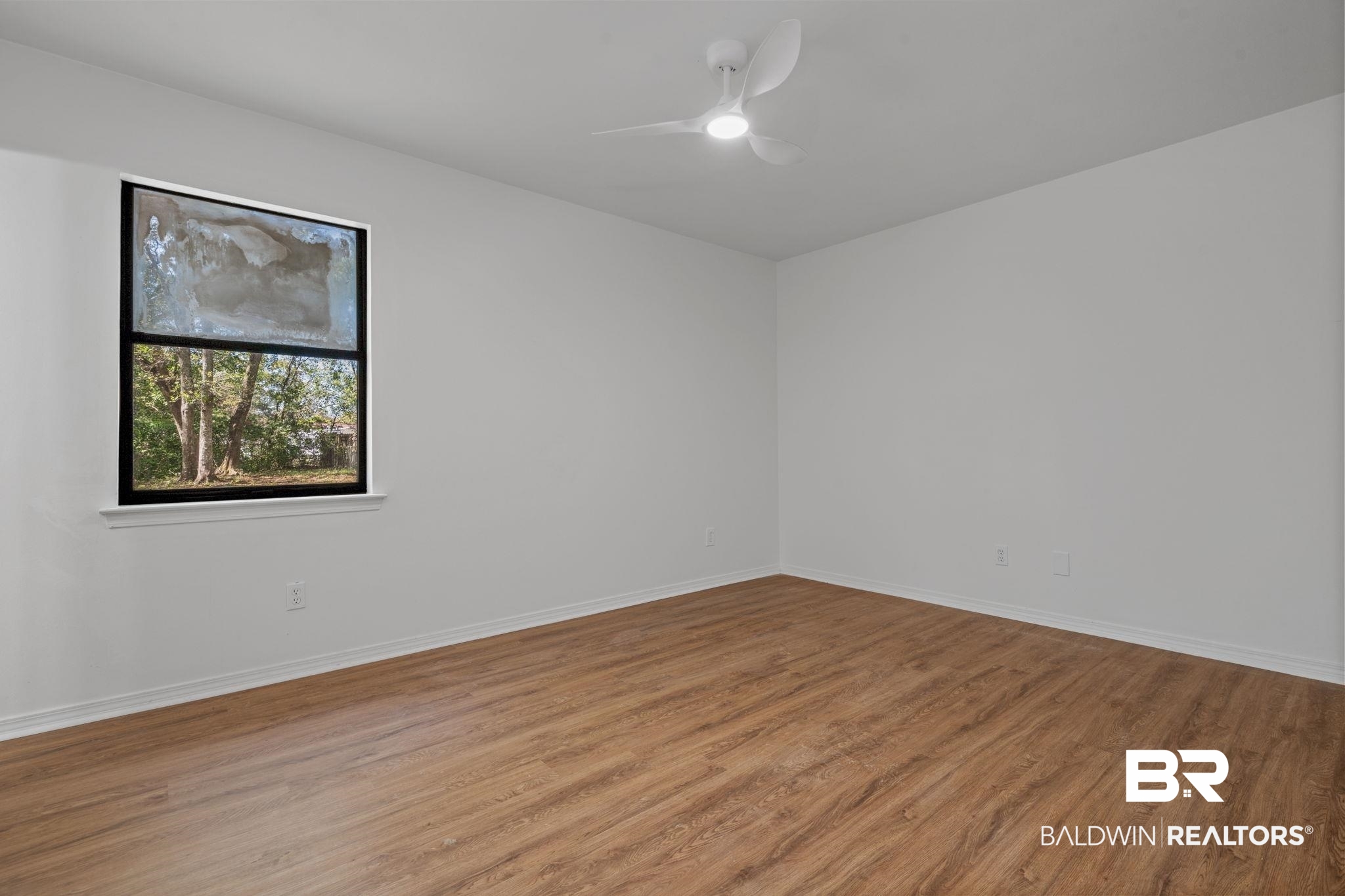 5734 Pheasant Court Theodore, AL 36582 - Photo 15 of 23 Spare room with wood finished floors and ceiling fan