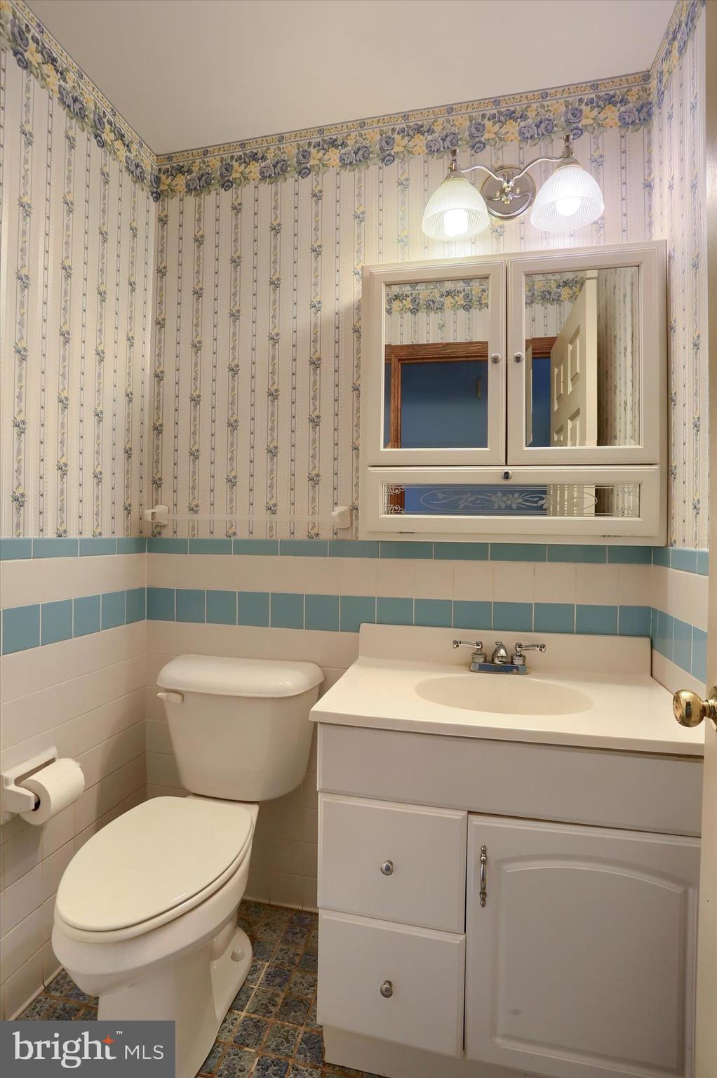15 Patton Road Mechanicsburg, PA 17055 - Photo 16 of 36 a bathroom with a toilet a sink and mirror