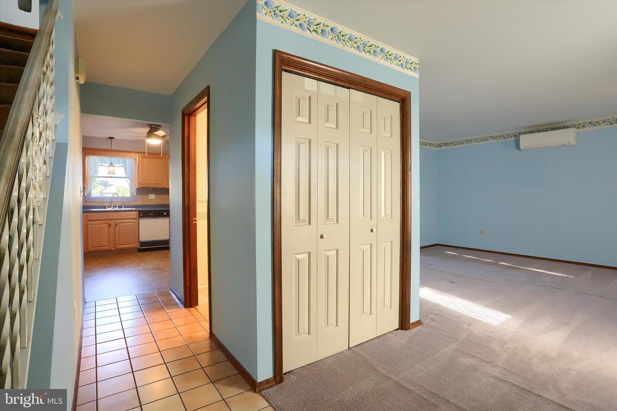 15 Patton Road Mechanicsburg, PA 17055 - Photo 4 of 36 a view of a hallway with a dining area a livingroom and front door