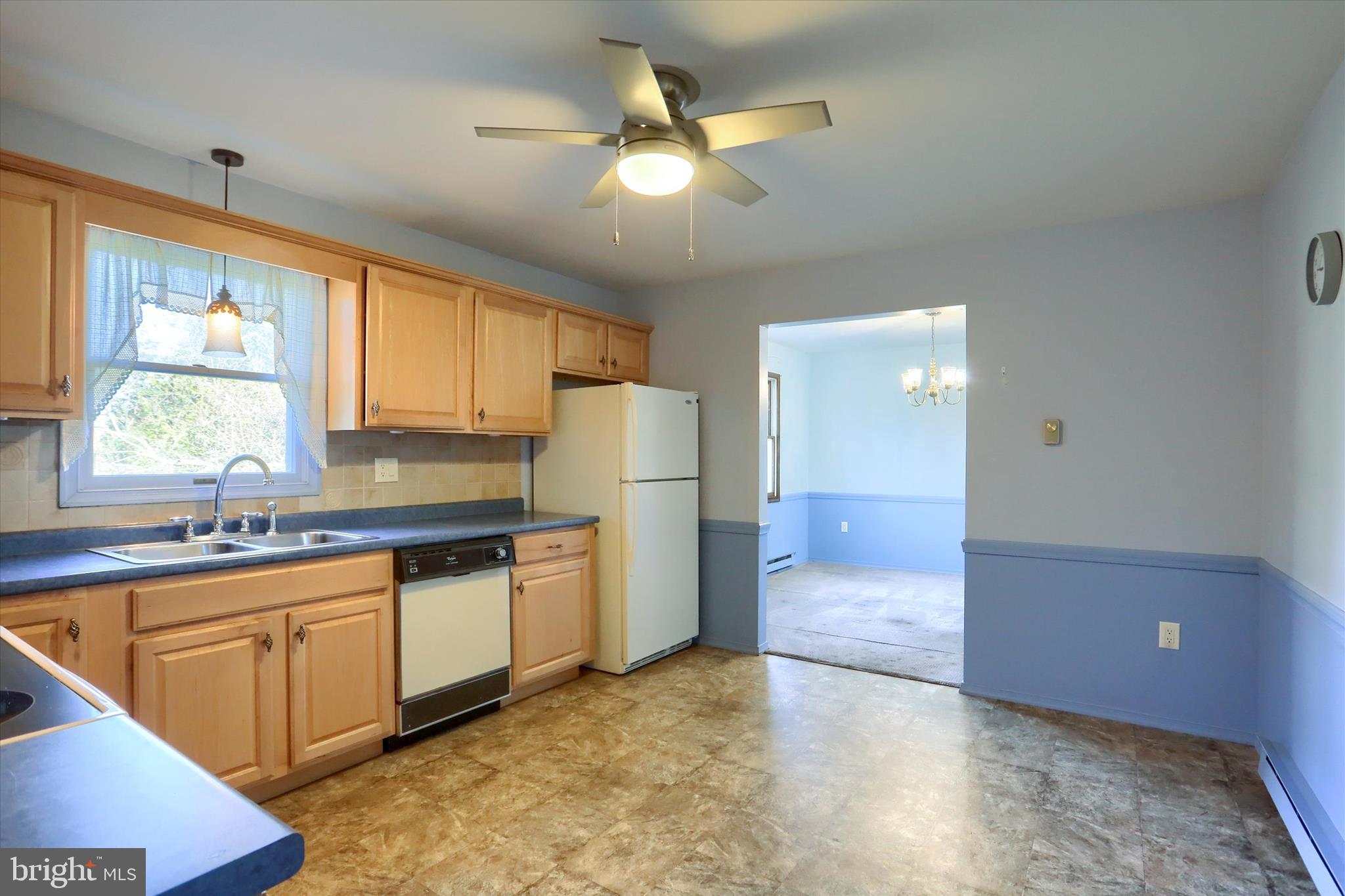 15 Patton Road Mechanicsburg, PA 17055 - Photo 10 of 36 a kitchen with granite countertop a sink a counter space appliances and cabinets