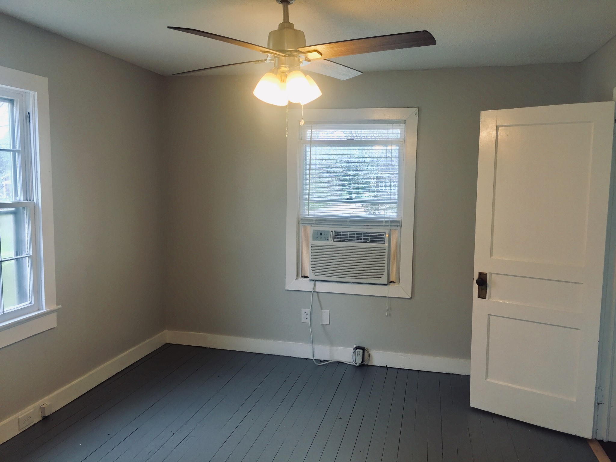 451 East Madison Street Pulaski, TN 38478 - Photo 15 of 16 an empty room with windows and fan
