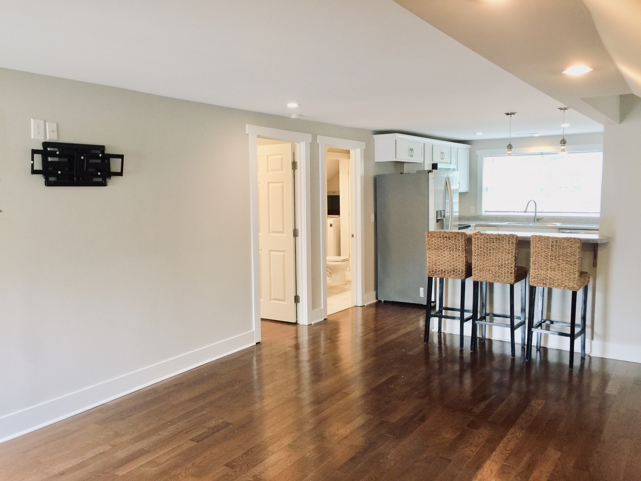 451 East Madison Street Pulaski, TN 38478 - Photo 6 of 16 a view of a kitchen with furniture and wooden floor