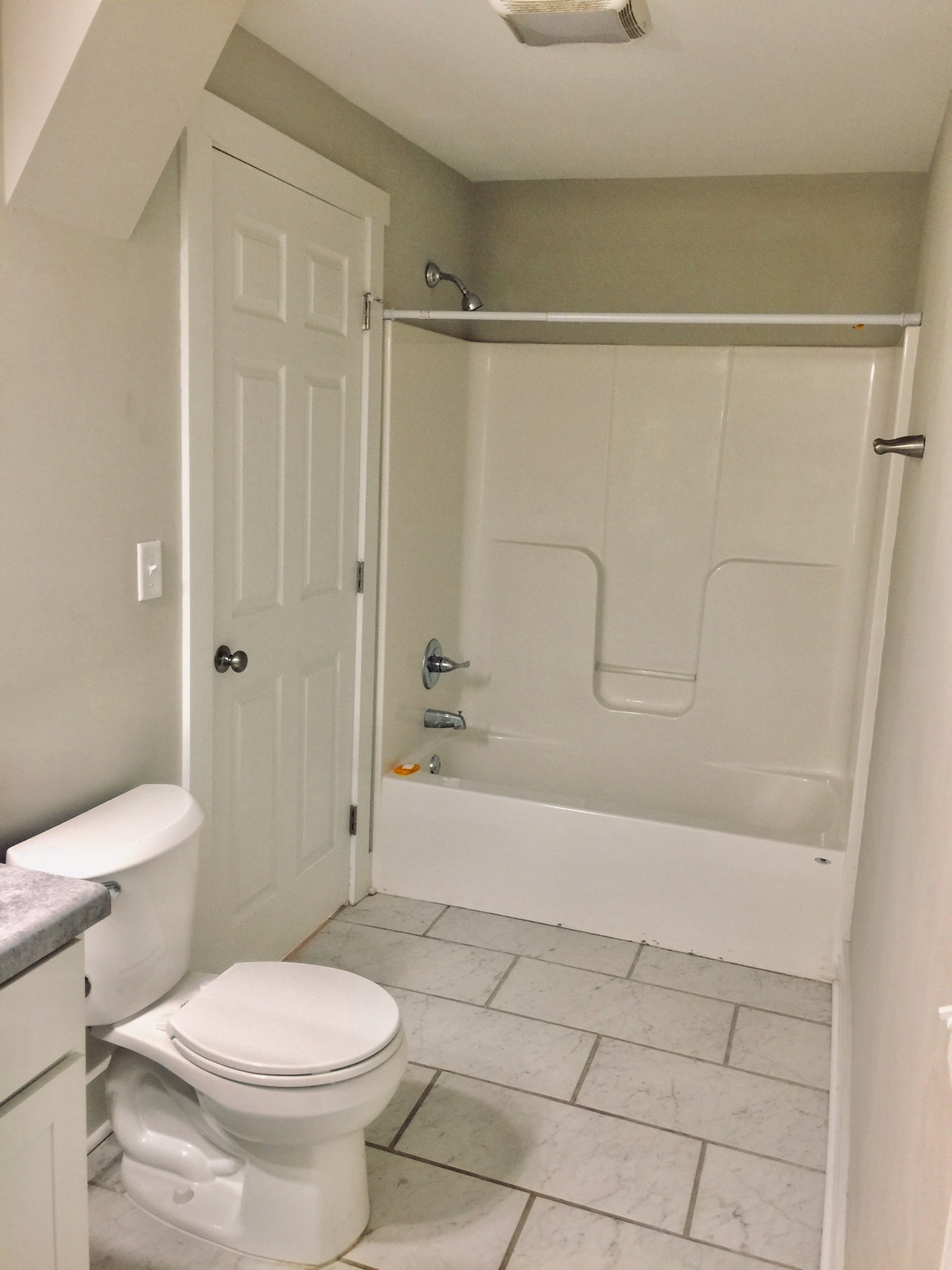 451 East Madison Street Pulaski, TN 38478 - Photo 8 of 16 a bathroom with a toilet and a shower
