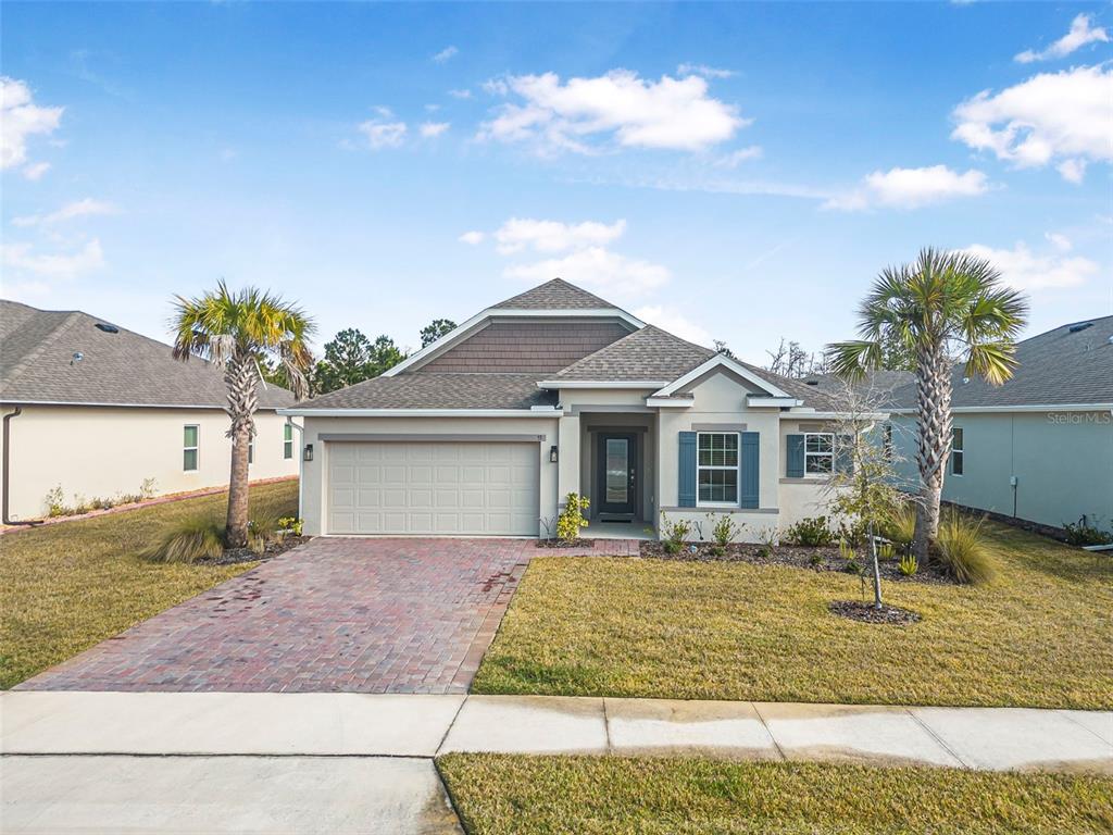 53 Fawn Hvn Trail Ormond Beach, FL 32174 - Photo 1 of 1 a front view of a house with garden