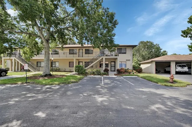 a front view of a house with a yard and porch