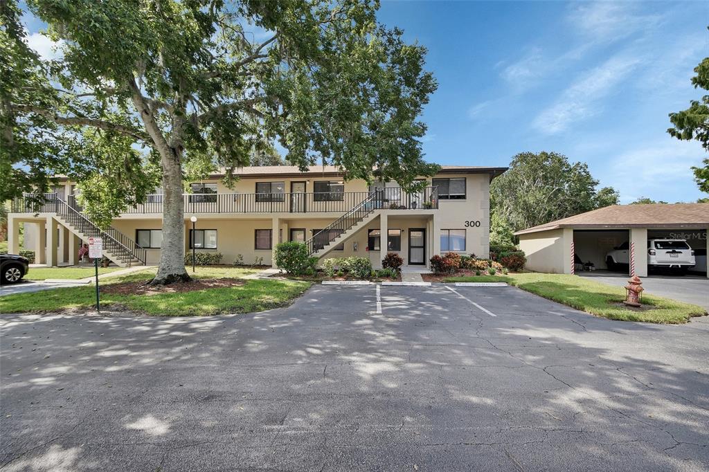 a front view of a house with a yard and porch