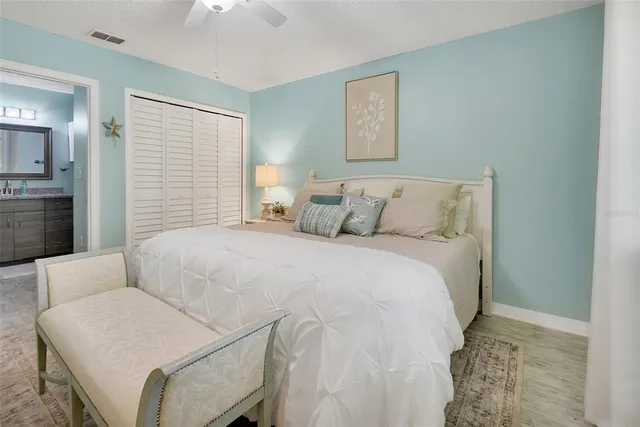 a bedroom with a bed and a couch