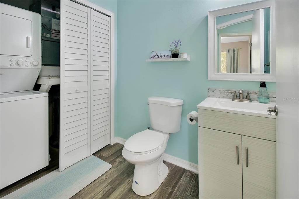 1601 Big Tree Road, Unit 307 South Daytona, FL 32119 - Photo 15 of 18 a bathroom with a toilet sink and mirror