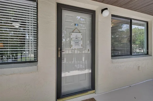 a view of a bathroom with a glass door