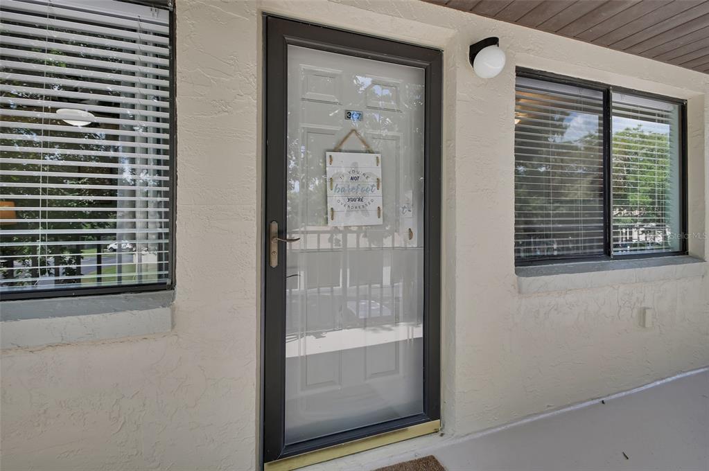 1601 Big Tree Road, Unit 307 South Daytona, FL 32119 - Photo 2 of 18 a view of a bathroom with a glass door