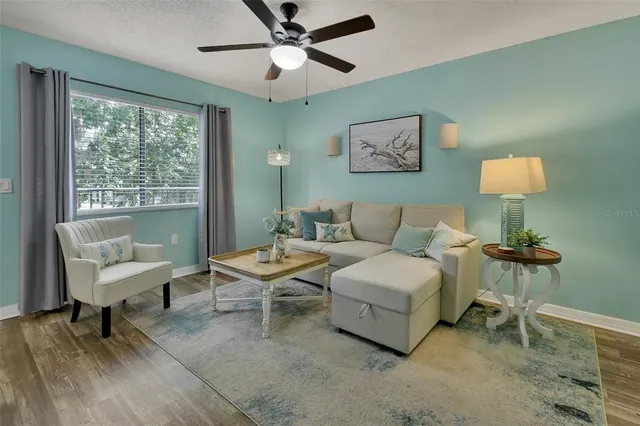 a living room with furniture and a window