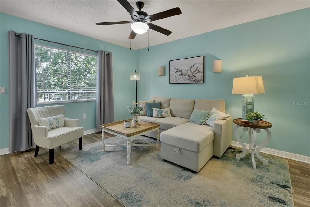 1601 Big Tree Road, Unit 307 South Daytona, FL 32119 - Photo 3 of 18 a living room with furniture and a window