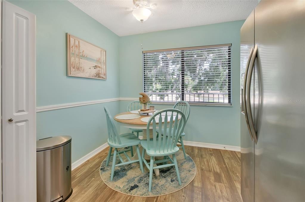 1601 Big Tree Road, Unit 307 South Daytona, FL 32119 - Photo 7 of 18 a view of a dining room with furniture window and outside view