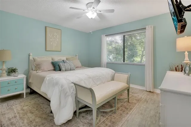 a bedroom with a bed and a table in it