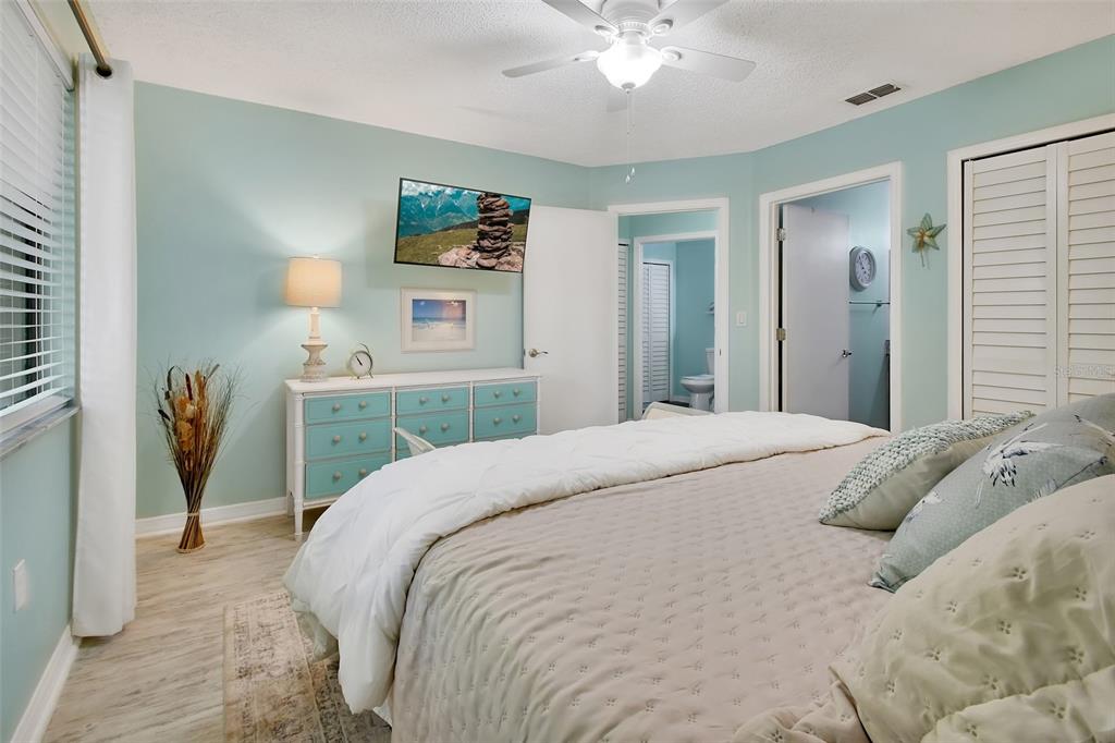 1601 Big Tree Road, Unit 307 South Daytona, FL 32119 - Photo 10 of 18 a bedroom with a bed and a chandelier
