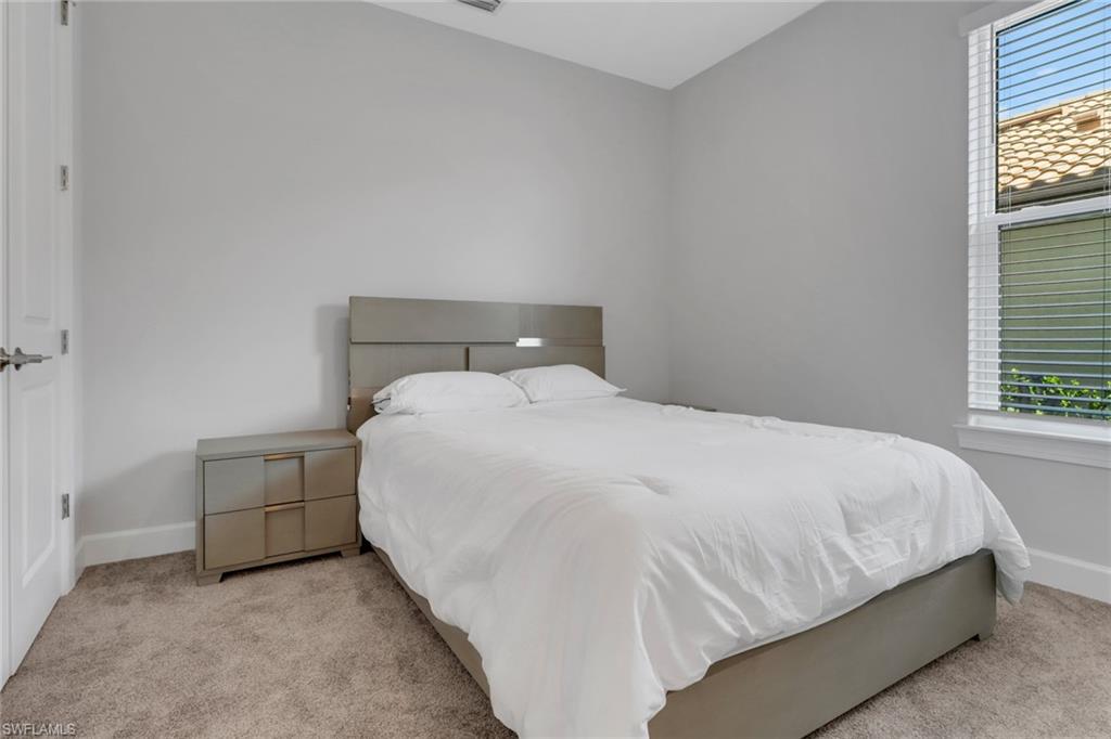 15561 Vittorio Street Naples, FL 34114 - Photo 11 of 16 Carpeted bedroom with baseboards