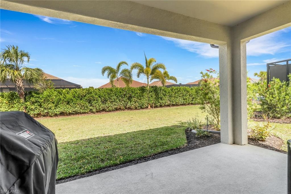 15561 Vittorio Street Naples, FL 34114 - Photo 15 of 16 View of yard with a patio area