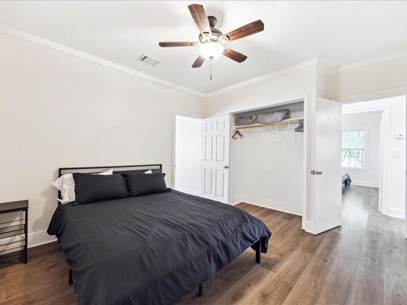 1801 Hussion Street Houston, TX 77003 - Photo 12 of 20 a bedroom with a bed and wooden floor
