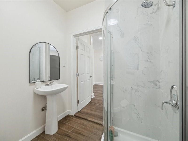 1801 Hussion Street Houston, TX 77003 - Photo 16 of 20 a bathroom with a sink a mirror and a shower