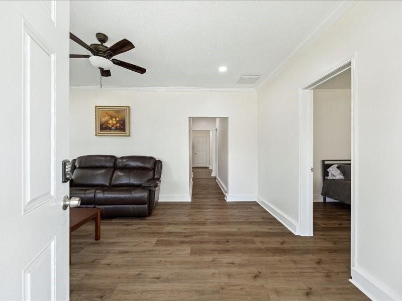 1801 Hussion Street Houston, TX 77003 - Photo 5 of 20 a living room with furniture and a wooden floor